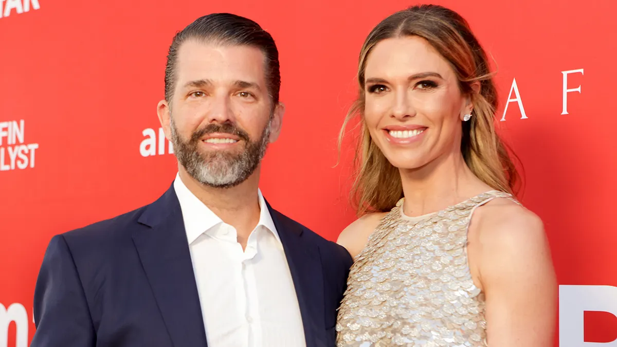 Donald Trump Jr. and Bettina Anderson stand together at an event.