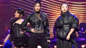 In this image published on December 31, 2025, KPOP Demon Hunters: The Singing Voices of HUNTR/X's Ray Ami, Ijae, and Audrey Nuna perform on stage. "Dick Clark's New Year's Rockin' Eve with Ryan Seacrest" 2026.