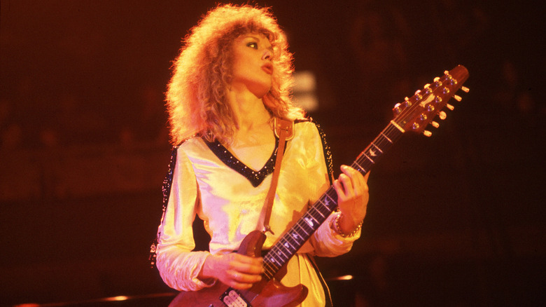 Heart's Nancy Wilson playing guitar at a concert