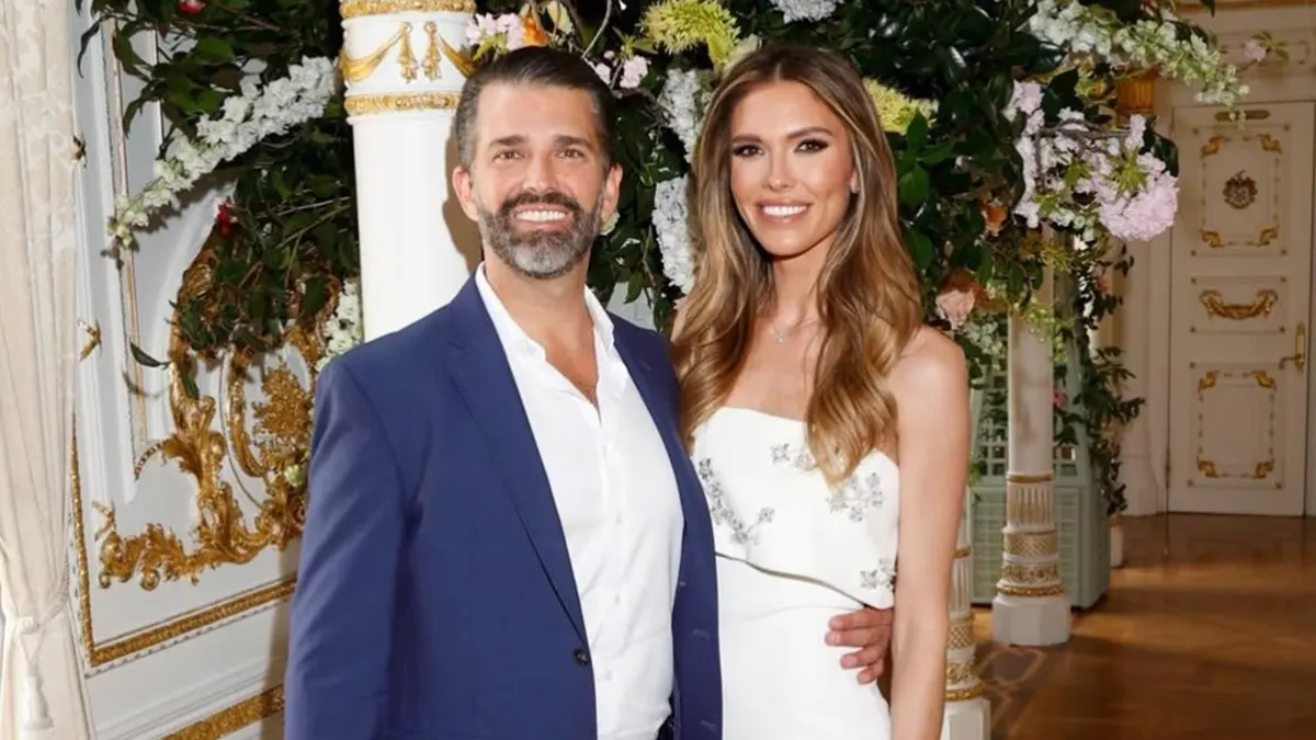 Donald Trump Jr. and Bettina Anderson sitting together